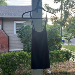 Long black tank top from fabletics. Fun black straps! Not used.